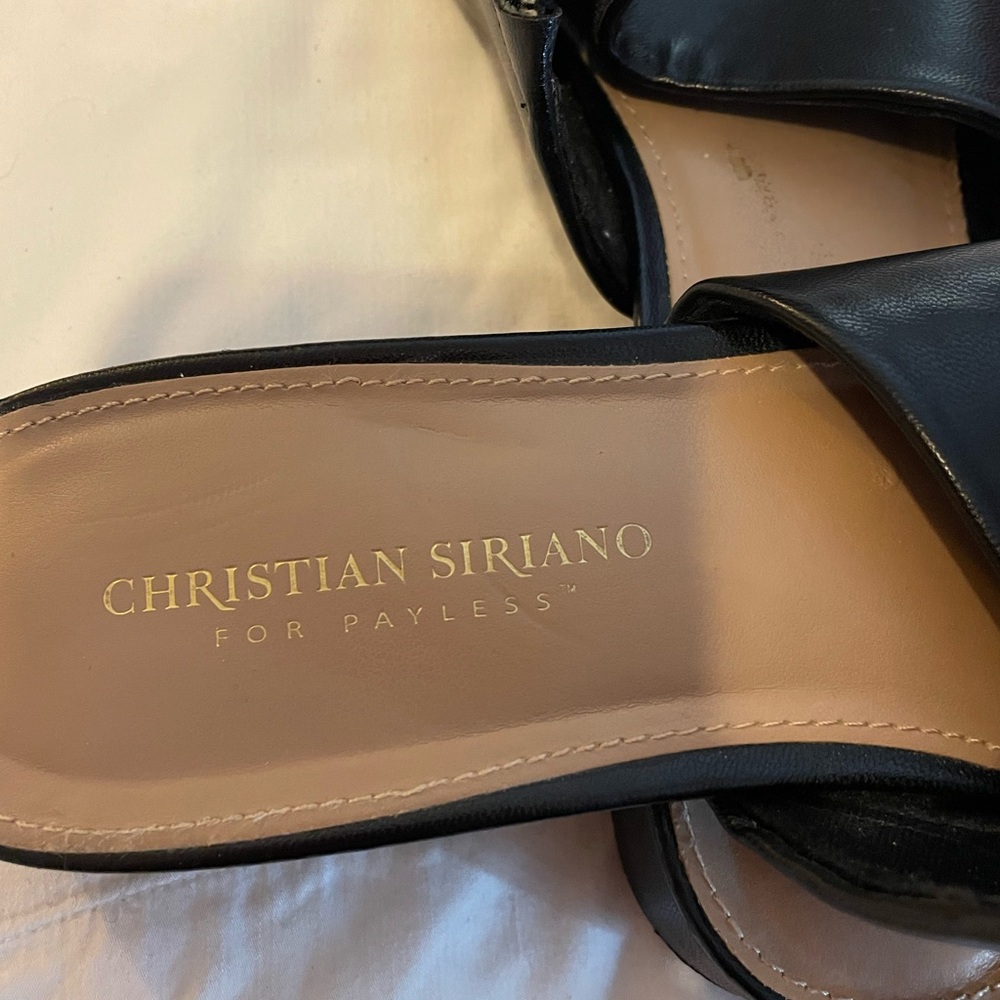 Size 11W black slip-on sandals.